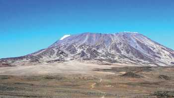 Mt Kilimanjaro rises above the flat African plains | Gesine Cheung