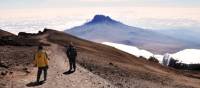 Trekkers descending Mount Kilimanjaro | Peter Brooke