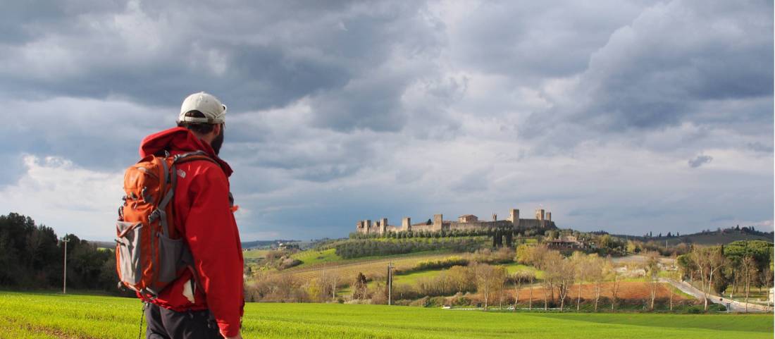 Italy Walker Admiring Monteriggioni Italy Walker Admiring Monteriggioni
