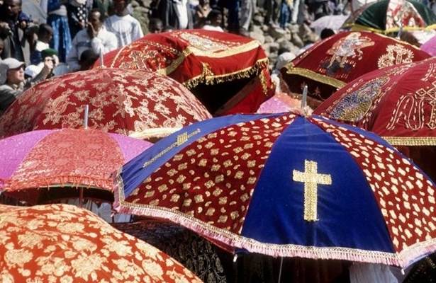 Umbrellas shade the priests and icons during the Timket Festival procession in Lalibela |  <i>Fiona Windon</i>