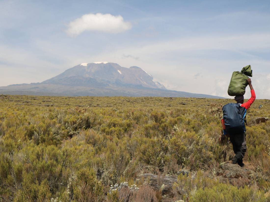 Porter heading towards Kilimanjaro |  <i>Kyle Super</i>
