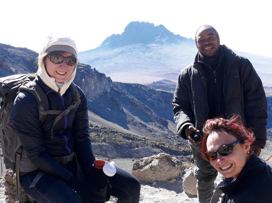 Quick drink break coming down Kilimanjaro -  Photo: Natalie Tambolash