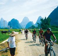 Cycling through rural villages Yangshuo, China -  Photo: Scott Pinnegar