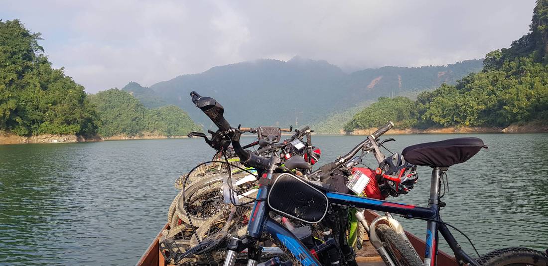 Boat transfer across the river to cycle Laos' backroads |  <i>Sandra Hopkins</i>