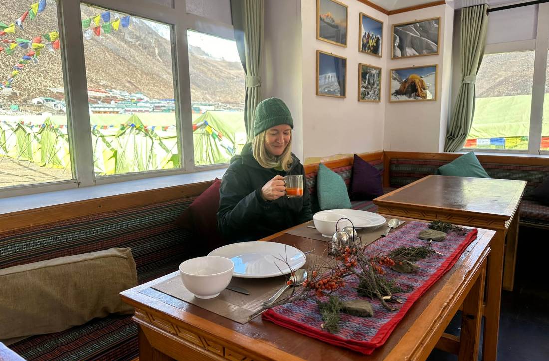 Enjoy some local seabuckthorn juice at our cosy Mountaineering themed Eco-Comfort Camp at Dingboche |  <i>Sarah Higgins</i>
