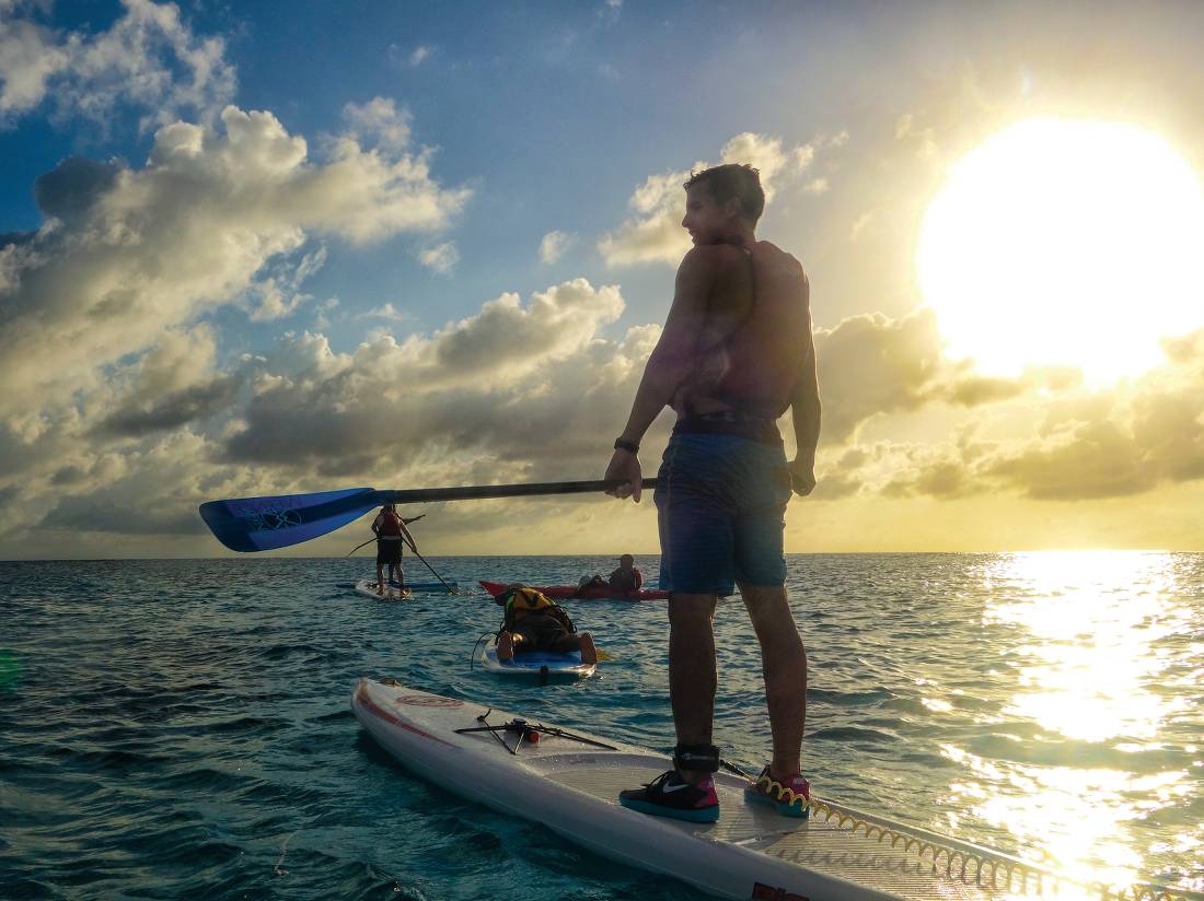 Stand up paddle boarding in the warm waters of Lighthouse Reef