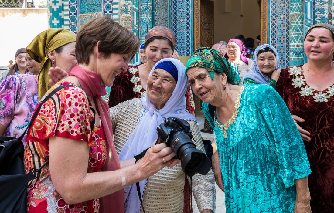 Pilgrims with traveller at Shah-i-Zinda, avenue of mausoleums, Samarkand |  <i>Richard I'Anson</i>
