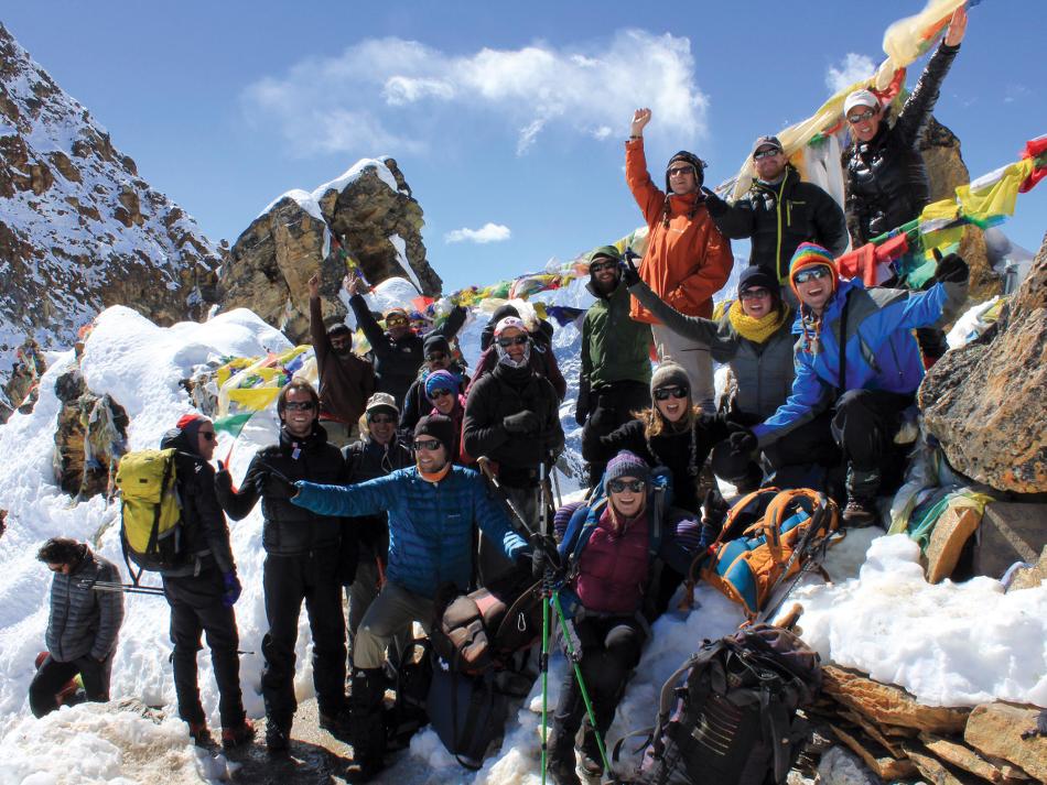 Happy group of trekkers atop of the Renjo La, Nepal -  Photo: Scott Cardwell