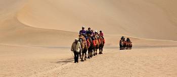 Camel riding at Mingsha Dunes in western China | Peter Walton