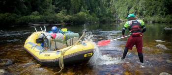 A guide splashes his raft on the Franklin | Glenn Walker