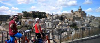 Cyclists take in the view in Sicily