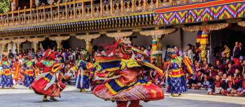 Bhutan's ceremonial celebrations include ornate masked dancers