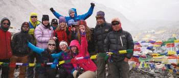 Trekkers posing for the camera at Everest base camp | Sally Imber